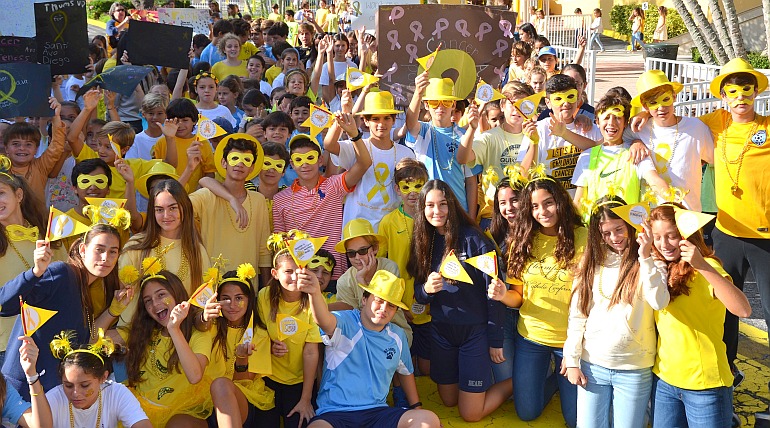 Middle school students do a "gold dress-down" in observance of the Month of Childhood Cancer Awareness at St. Agnes Academy.
