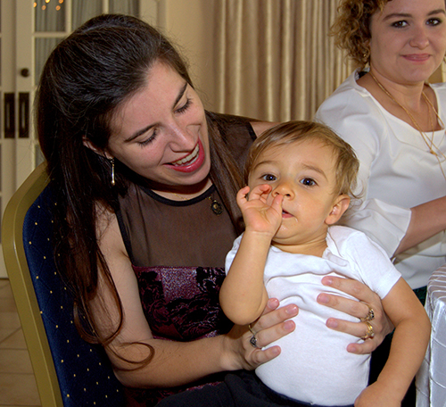 Elsa Barredo cuddles her son Francisco during a brunch cosponsored by the archdiocesan Respect Life Office and the Cuban Association of the Sovereign Order of Malta.