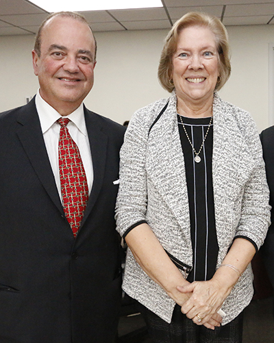 Incoming Respect Life Director Juan Guerra poses with his predecessor, Joan Crown, during her retirement party at the Pastoral Center Oct. 4.