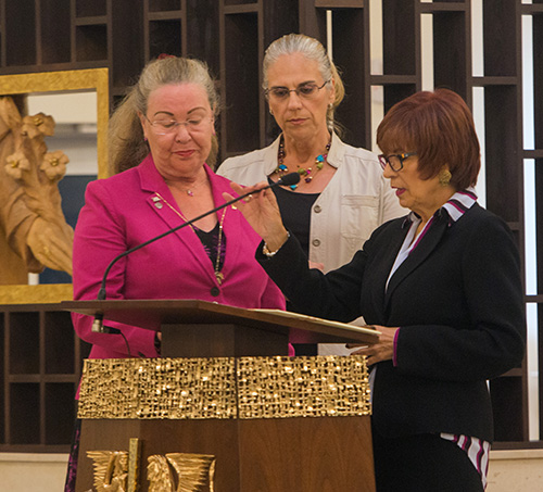 St. Catherine of Siena parishioners proclaim the readings in three languages, from left: Katy Zakas, English, Giselle Alves, Portuguese, and Eleonora Poletti, Spanish.