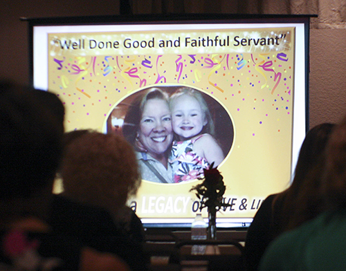 Powerpoint image of Joan Crown pictured with her granddaughter, Stella. It was shown as part of a presentation on Crown's life and times at a reception in her honor Oct. 20 at St. David Parish in Davie.