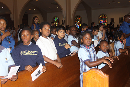Students of St. Mary Cathedral School take part in the weekly school Mass. The school teaches children from PreK3 through eighth grade.