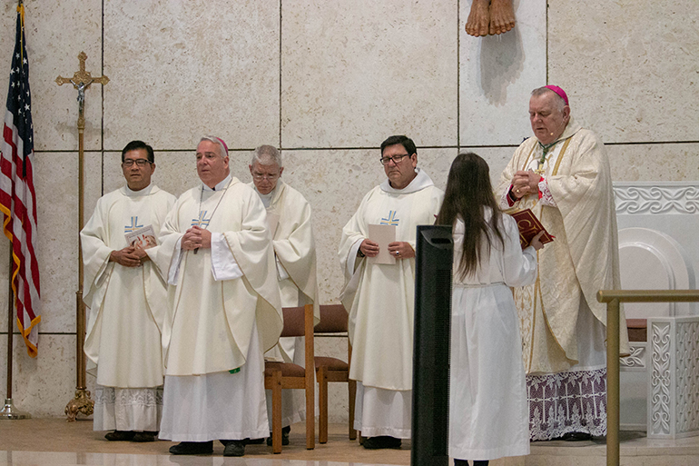 Archbishop Thomas Wenski, joined by Bishop Nelson Perez of Cleveland, second from left, and several archdiocesan priests, celebrates the opening Mass of the annual Catechetical Day, held Nov. 3 at St. Mark Church in Southwest Ranches.