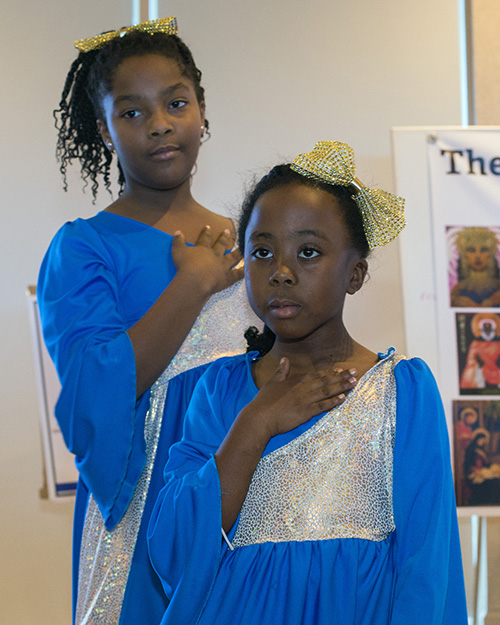 Megan Juste, 12, and Kayla Weaver, 7, members of Mbofro Ne Nyame, "Children and God" dance group, perform for the audience during the Archdiocese of Miami's Office of Black Catholic Ministry celebration of Black Catholic History Month, Nov. 17 in Miami Gardens.