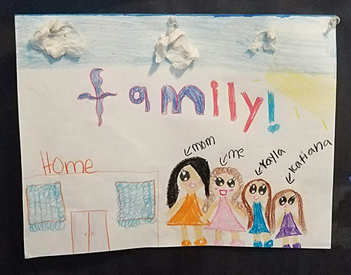This picture depicts New Life Family Center's goal of keeping families together. Often, homeless families are split up into different shelters. At New Life, the whole family unit is welcomed.