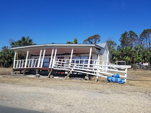 This file photo, taken during an initial assessment tour by Miami's Catholic Charities staff back in October, shows the destruction wreaked by Hurricane Michael in Florida's Panhandle. A group of mental health counselors who returned to the area in early December noted that the Christmas holidays are both a distraction and an underlying stress factor for families, both emotionally and financially.
