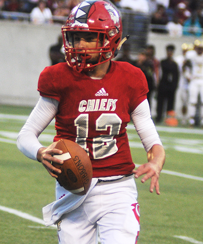 Cardinal Gibbons quarterback Brody Palhegyi runs for a 6-yard touchdown in the fourth quarter against North Marion.