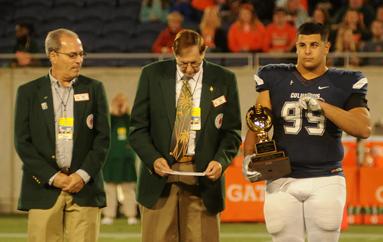 Columbus defensive tackle Dylan Perez accepts the FHSAA's Henry O. Langston Award given to the each state finalist's top scholar-athlete. Perez has committed to accepting an appointment to the U.S. Military Academy in West Point, N.Y.