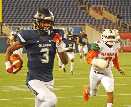 Columbus receiver Xzavier Henderson outraces Mandarin defensive back Travis Moss during Henderson's 71-yard touchdown reception early in the first quarter.