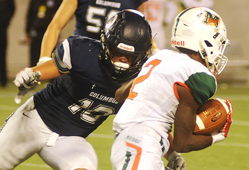 Columbus defender Elijah Morales tackles Mandarin receiver Darian Oxendine during the third quarter Dec. 8. Morales had 10 tackles and 1.5 sacks.