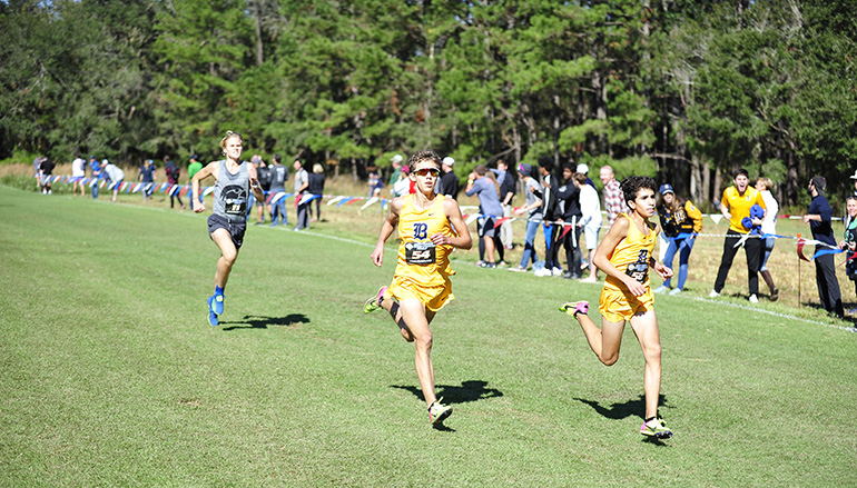 Belen Jesuit sophomore Javier Vento, right, and freshman Adam Magoulas, left, placed first and second in the 5K run at the Class 3A state boys cross-country championships to lead the school to its 10th state championship.