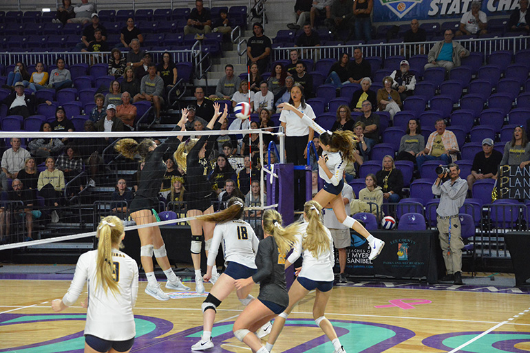 St. Thomas Aquinas senior Sophia Davis goes for the kill during the Raiders' Class 8A state championship game against Tampa Plant Nov. 17 in Fort Myers.