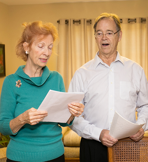 Dolores Hanley and John McDiarmid sing Christmas carols.