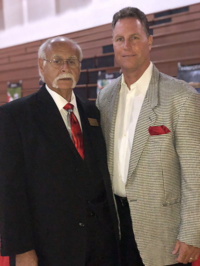 Msgr. Pace High School footbal coach Joe Zaccheo is pictured here with Tom Duffin, a class of '85 Pace alumnus. Coach Duffin, Pace's head baseball coach for 20 years, will succeed Zaccheo as athletic director.