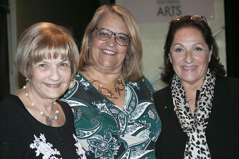 Three former Pedro Pans who helped organize the documentary showing at Immaculata-La Salle High School pose for a photo, from left: Carmen Romanach, first vice president of Operation Pedro Pan Group, Cristina Brito, development director for Immaculata-La Salle, and Carmen Valdivia, executive producer of the documentary and chair of Pedro Pan Group's Historic Committee.