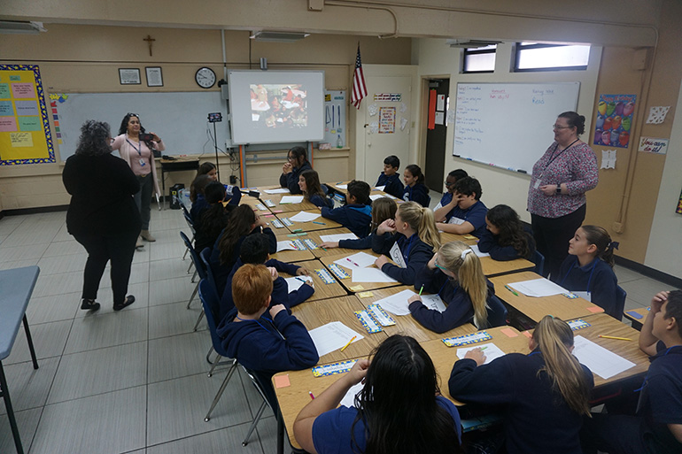 St. Jerome School fifth-graders take part in a video conference with fifth graders at Donna Klein Jewish Academy. It was the first of many during which they will discuss a book both classes are reading, "Wonder."