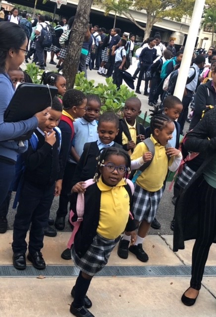 Students arrive for school at St. James in North Miami, which has seen a resurgence in enrollment over the past five years. St. James has 410 students on scholarship, up from 302 five years ago. About 90 percent are of Haitian descent. The vast majority of their parents would not have been able to afford tuition without the scholarship. Most are paying $ 500 to $ 600 a year with it.