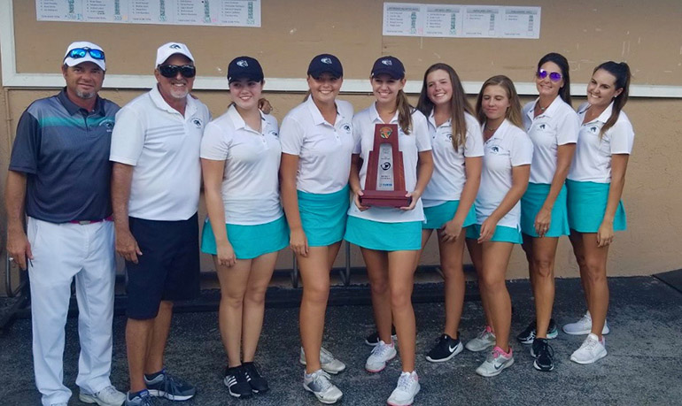 Archbishop McCarthy High School's girls golf team, who took second place statewide in Class 2A, pose with their coaches after their win at the district level. From left: Coach Carl Phillips, Coach Henry Portela, Erin O’Donnell, Natalia Jimenez, Jennifer Lilly, Rileigh Baker, Morgan Herring, Coach Jean Carver, and Coach Lauren Carver.