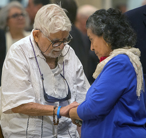 Together for 70 years, Nestor and Nora Perez renew their wedding vows at the annual Mass for marriage jubilarians, celebrated Feb. 16 by Archbishop Thomas Wenski at St. Mary Cathedral.
