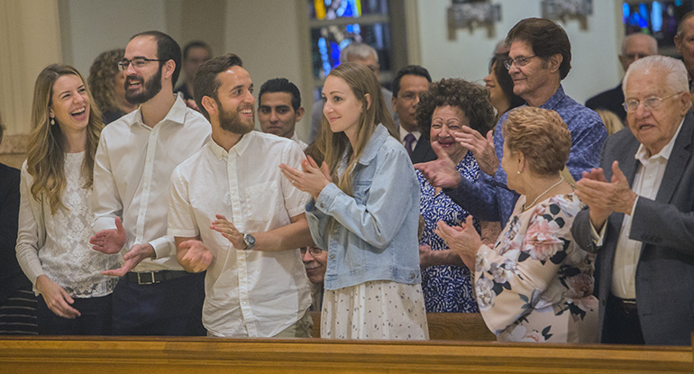 Julia and Tomas Ferrer and AJ and Melissa Tablada are recognized when Archbishop Thomas Wenski asked couples married one year to stand, during the annual Mass for wedding jubilarians Feb. 16 at St. Mary Cathedral.