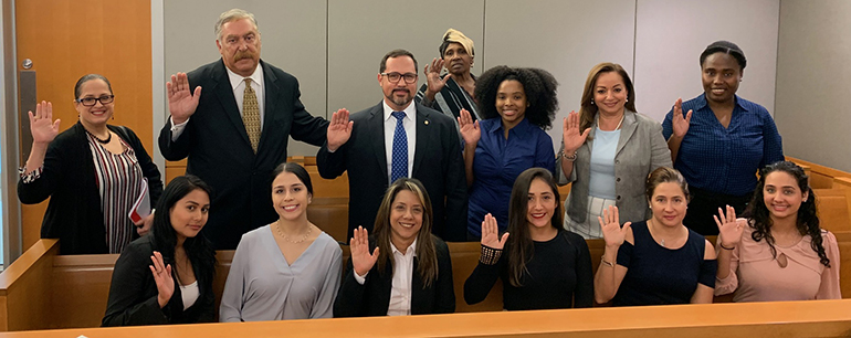 The initial class of Guardians ad Litem recruited through the Hope, Heart & Home Ministry take their oath in the Miami Dade Children's Courthouse. They are: Lourdes Andujas, Mary Andujas, Joselito Burgos, Martha Pomares-Candia, Maria Garcia Granados, Maddy Garcia, Thais Guevara, Taylor Hobbs, Carmen Lugo, Blanca Palomino, Louvenia Smith, Eric Schwindeman, and Cylena Stewart.