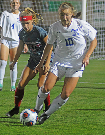 Cardinal Gibbons midfielder Chloe Depenbrook defends Bolles midfielder Avery Patterson during the first half Wednesday, Feb. 20, 2019. Bolles defeated Cardinal Gibbons 5-1. It was Cardinal Gibbons' first state final since 2009.