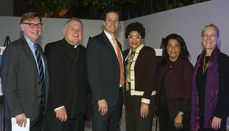 From left: Randolph McGrorty, CEO of Catholic Legal Services, and Archbishop Thomas Wenski pose with Mother Cabrini award recipient Michael S. Vastine, St. Thomas University law professor and director of its immigration clinic, as well as STU Law School Dean Tamara Lawson, STU Immigration Clinic Coordinator Yanick Laroche, and Cece Dykas, STU associate dean of academic affairs and clinical programs director.