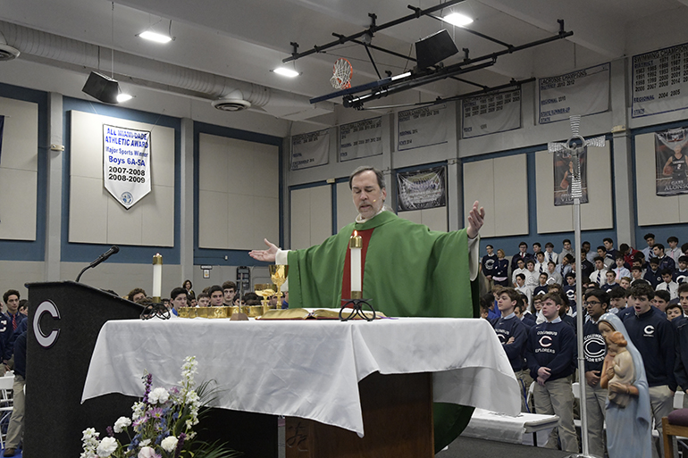 Father Alejandro Rodriguez Artola, pastor of St. Thomas the Apostle Church in Miami and a member of Christopher Columbus High School's class of 1981, celebrates Mass for Catholic Schools Week, Jan. 31, at his alma mater.