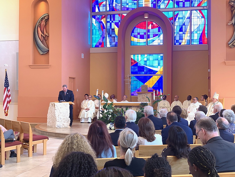 St. Thomas University President David Armstrong says a few words after Archbishop Thomas Wenski celebrated a Mass to mark the 15th anniversary of the dedication of St. Anthony Chapel on the university's Miami Gardens campus.