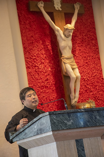 Father Peter Lin, spiritual director of the Chinese Apostolate, gives the final remarks during the ancestral veneration ceremony that followed the Mass marking the start of the Chinese New Year.