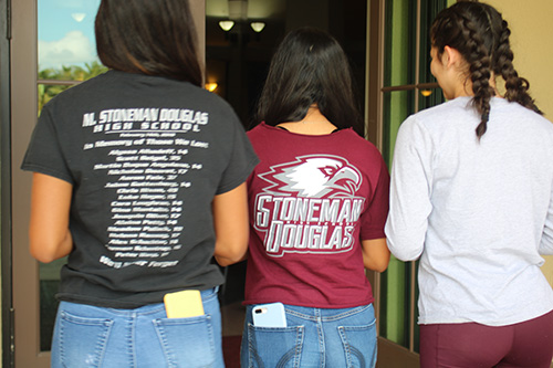 Valentina Zuniga, left, and her sister Gabriella, center, along with Camila Escobar, right, enter Mary Help of Christians in Parkland to pray for friends lost in the shooting at Marjory Stoneman Douglas High School Feb. 14, 2018. Mary Help of Christians held a holy hour on the first anniversary of the tragedy so that people could pray for the victims, their grieving families, and peace.