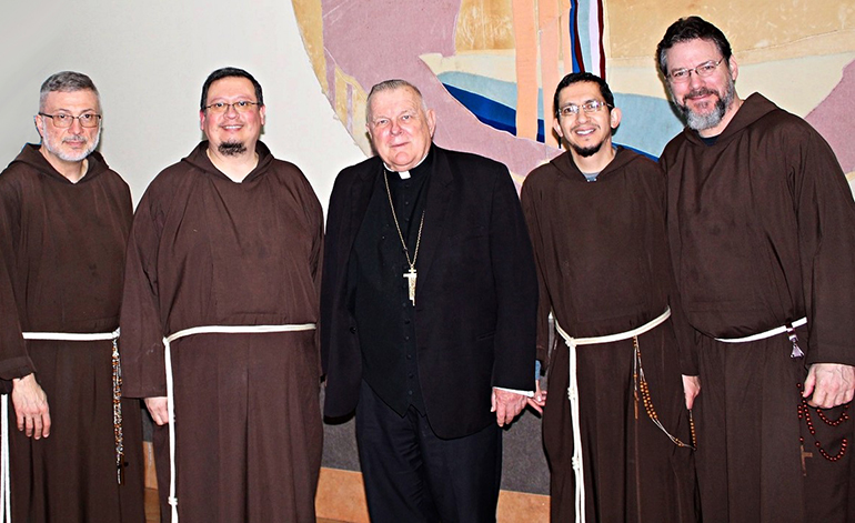 Father Nicholas Mormando, far left, and Brother Lombardo D’Auria, second from left, are the first of an expected three Capuchin Franciscan friars who will work at the newly-erected St. Pio Friary located at St. Jerome Parish in Fort Lauderdale. They are pictured here with Archbishop Thomas Wenski and representatives of the community's New Jersey/Southeast USA Province: Provincial Minister Father Remo DiSalvatore, far right, and Provincial Council member Father Francisco Arredondo, second from right.