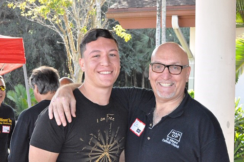 St. Edward parishioners Lou Paonessa and his son, Nick, pose for a photo after attending a ManUp conference.