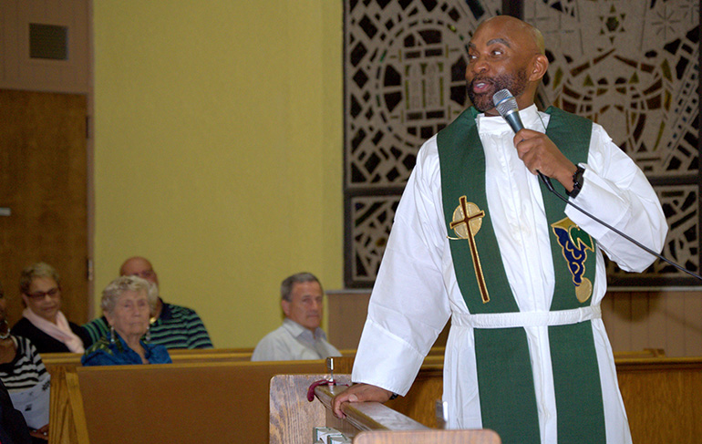 Guest preacher Father Roy Lee of Atlanta speaks during a revival at St. Bernard Church presented by the archdiocesan Office of Black Catholics.