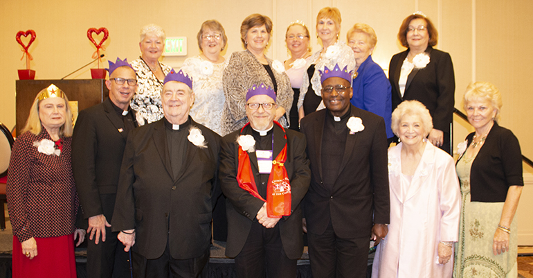 Spiritual moderators of diocesan councils of Catholic Women stand with affiliate presidents and national affiliate past presidents.