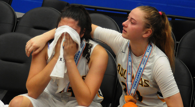 St. Thomas Aquinas senior Halie Murphy, right, consoles junior forward Angelee Rodriguez after their 58-52 overtime loss to Tampa Bay Tech in the FHSAA Class 8A Girls Basketball State Championship game on Saturday, March 2, 2019, at the RP Funding Center in Lakeland. (Lynn Ramsey | FC)