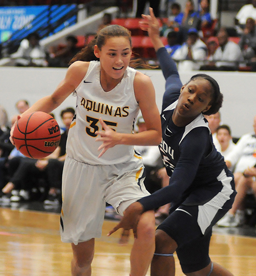 St. Thomas Aquinas' Abigail Hsu, left, drives past Tampa Bay Tech's Janiah Barker in the first half of Tampa Bay Tech's 58-52 overtime victory March 2 in the FHSAA Class 8A girls basketball state championship game. Hsu had 10 points, while Barker had 17 points and 10 rebounds.