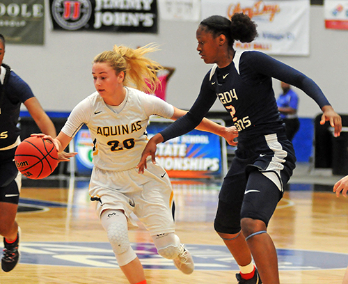 St. Thomas Aquinas' Halie Murphy tries to move around Tampa Bay Tech's Janiah Barker in the first half of Tampa Bay Tech's 58-52 overtime victory Saturday, March 2 in the FHSAA Class 8A girls basketball state championship game at the RP Funding Center in Lakeland.