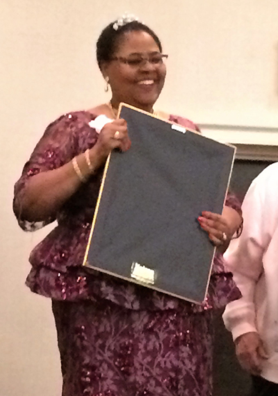 Josephine Gilbert, past president of the Miami Archdiocesan Council of Catholic Women, receives the Our Lady of Good Counsel Award at the 2018 Florida Council of Catholic Women's annual convention, held in February in Orlando. The event was postponed by the passage of Hurricane Michael.