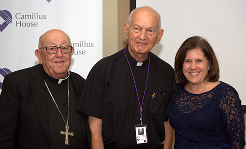 Hospitaller Brother Raphael Mieszala, center, poses for photos with fellow workers at Camillus House after his farewell Mass. Posing with him are retired Miami Archbishop John C. Favalora, who volunteers at the central shelter twice a week; and Hilda Fernandez, CEO of Camillus House.