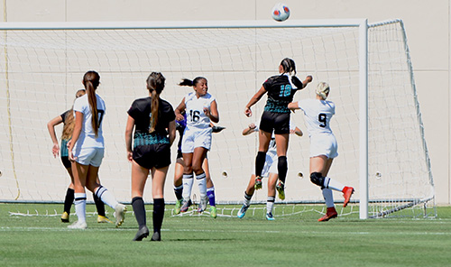 Archbishop McCarthy players, including forward Jordyn Pitter (18), battle in front of the Montverde goal during the state championship final. Pitter, who has committed to playing soccer at the University of Central Florida, had nine goals on the season.