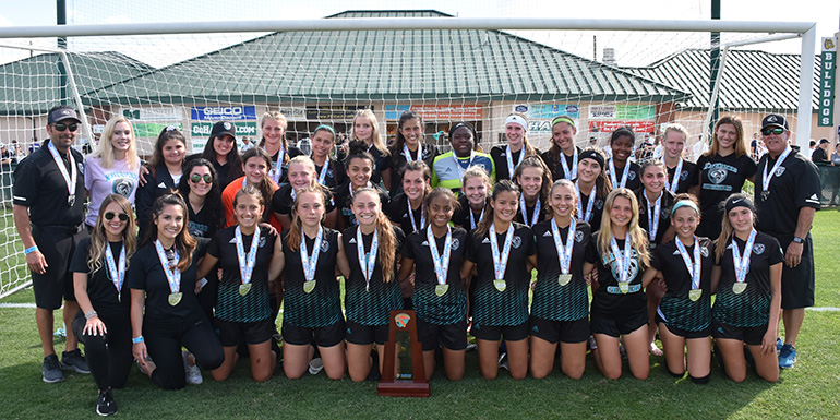 Archbishop McCarthy High's girls soccer team pose with their coaches and state championship runner-up trophy after battling Montverde to a 0-1 score in the Feb. 22 final.