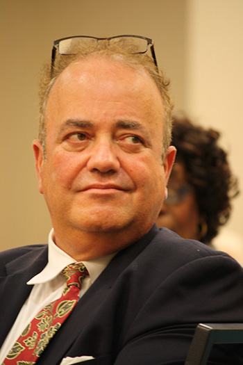 Juan Guerra, new director of the Archdiocese of Miami Respect Life Office, listens to his predecessor, Joan Crown, who was honored at the 2019 Scholarship Luncheon hosted by the Miami Archdiocesan Council of Catholic Women, Feb. 23 at the Embassy Suites in Fort Lauderdale.