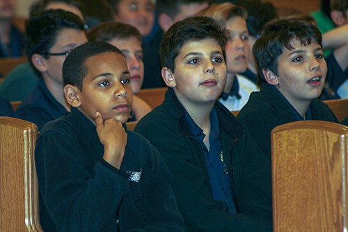 Sixth graders enjoy talks by seminarians during the Focus 11 vocations rally Feb. 27 at host St. Gregory Parish in Plantation.