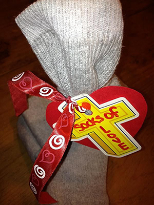 A sample of the Socks of Love packages created by third- and fourth-graders at Mary Help of Christians School in Parkland. The toiletries are inside one sock, which is wrapped inside the other one.