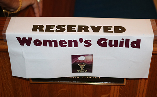 A sign marks a pew reserved for members of the St. Anthony Women's Guild.