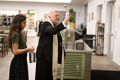 Miami Archbishop Thomas Wenski blesses the new parish and student center facilities at Mary Help of Christians Parish in Parkland, serving northwestern Broward County. The event was held March 4.