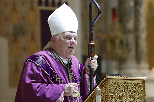 Archbishop Thomas Wenski preaches the homily while celebrating Ash Wednesday Mass at Gesu Church in downtown Miami, March 6, 2019.