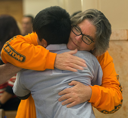 Rose Anderson, sponsor, hugs Juan Tito Benito, 12, a Guatemalan who came to the U.S. as an unaccompanied minor in 2017.