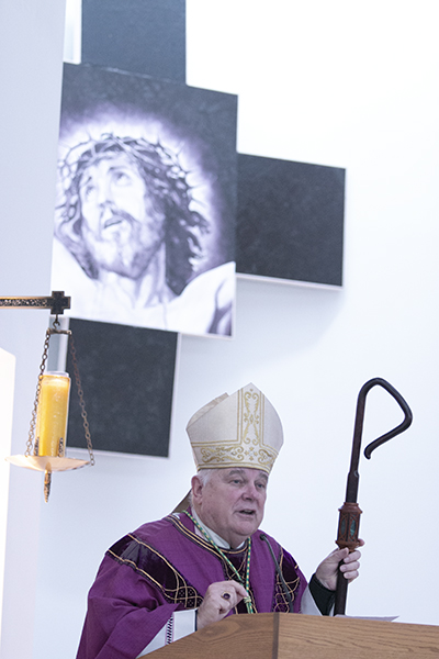 Archbishop Thomas Wenski preaches the homily during the Mass that opened the archdiocesan Evangelization Summit, March 16, 2019, at Msgr. Edward Pace High School in Miami Gardens.